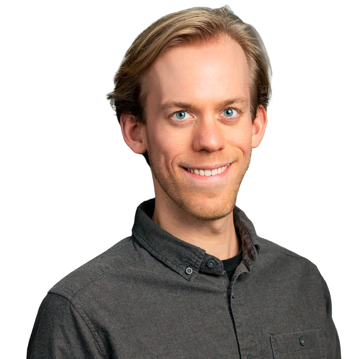 Headshot of Matthew Schepers smiling, wearing a dark gray button-down shirt, white background